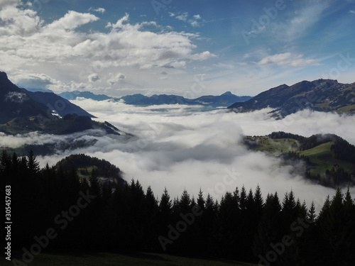 Views of the cloudy valley from the Col des Mosses in the Bernese Alps of Switzerland © JaviJfotografo