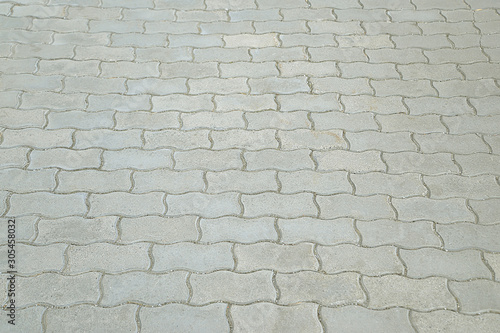 Old road grey mosaic pavement texture