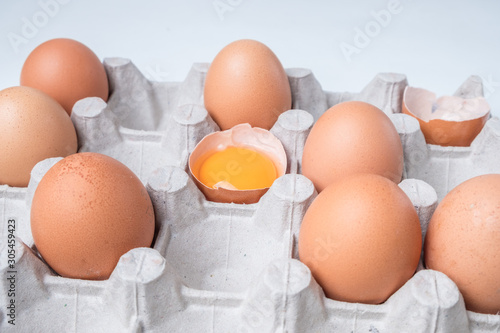 cardboard box with brown chicken eggs