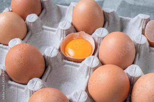 cardboard box with brown chicken eggs