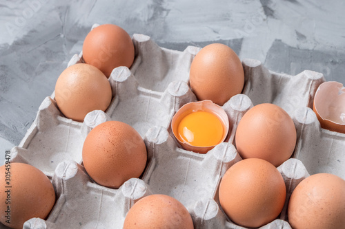 cardboard box with brown chicken eggs