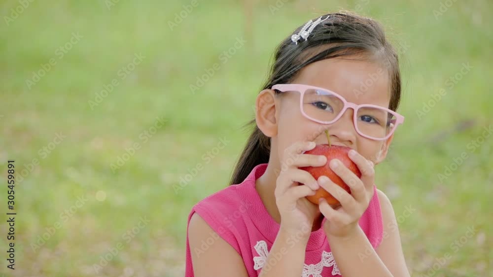 girl eating an red apple. Cute girl chewing red apple. girl eating an red apple. Cute girl chewing red apple.