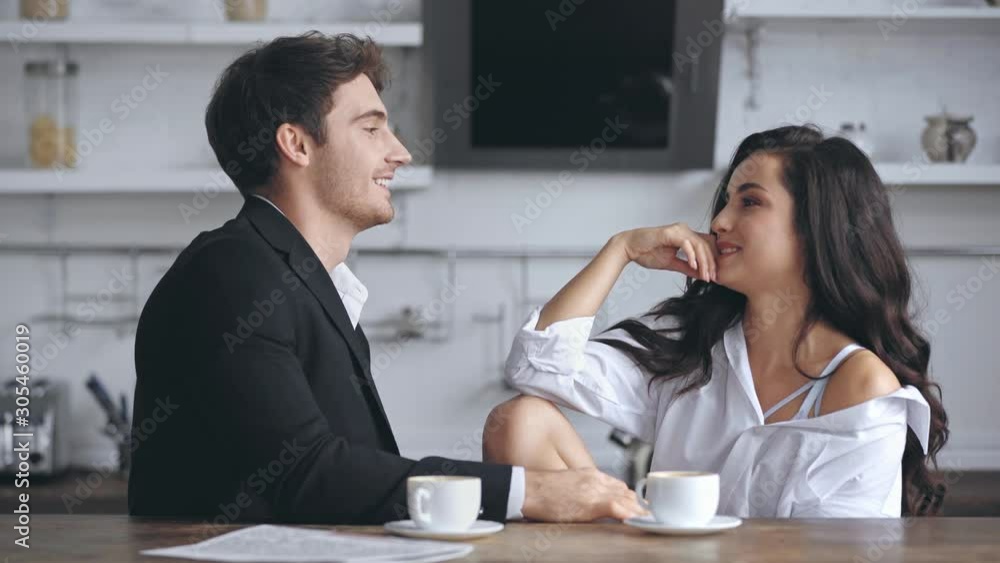 businessman smiling and talking with girlfriend businessman smiling and talking with girlfriend