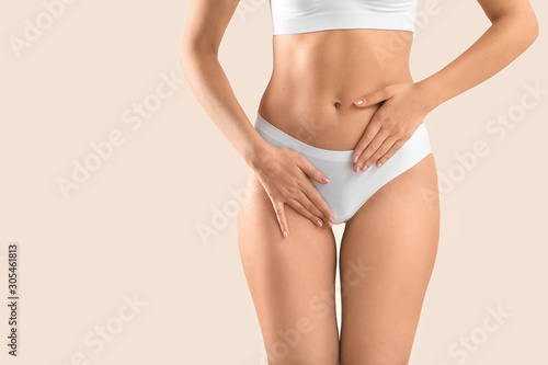 Young woman on light background, closeup. Gynecology concept photo