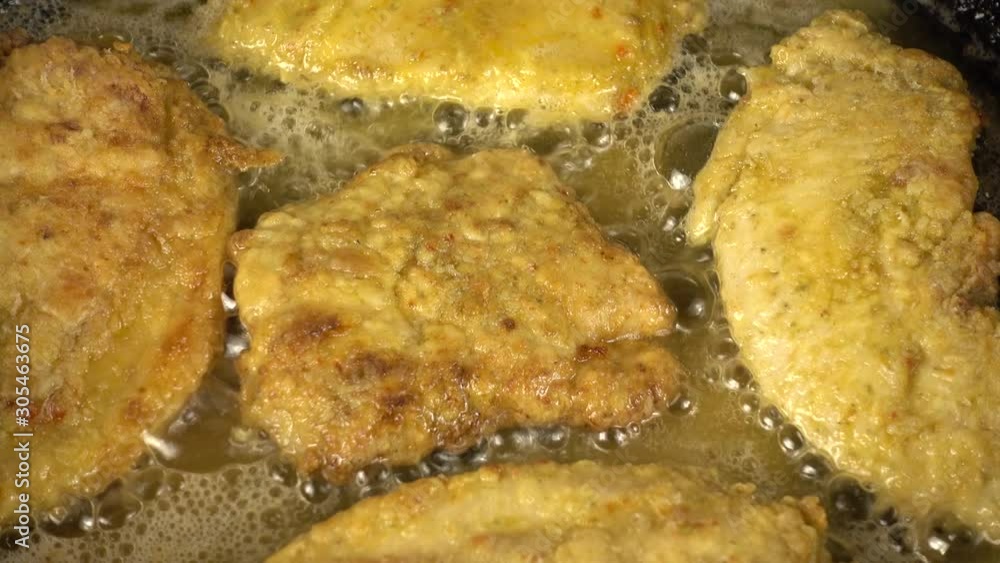 Preparation of a chicken chop on a cast-iron pan. Preparation of a chicken chop on a cast-iron pan.