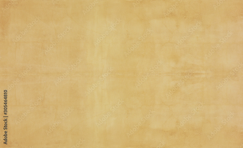 Old beige background surface. Rough sandy or stone canvas, empty light brown wallpaper, blank wall banner 