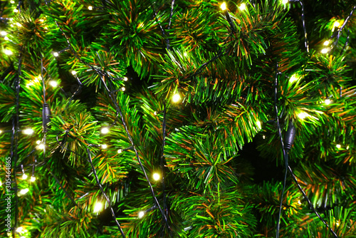 Close up christmas tree decorate with small light