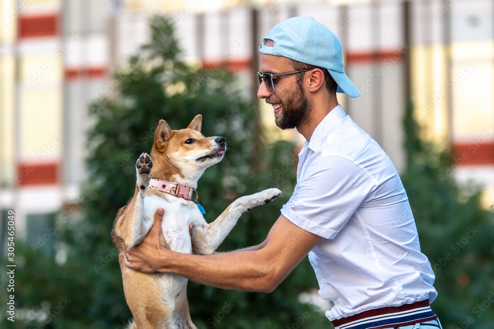 Owner walk with Shiba inu dog in park 