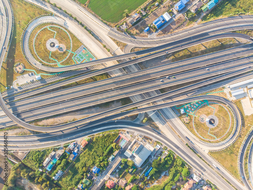 Transport junction freeway road with vehicle movement in morning rural of Thailand