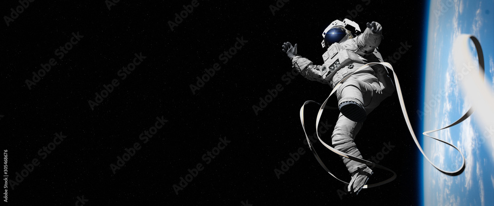 astronaut in orbit of planet Earth 