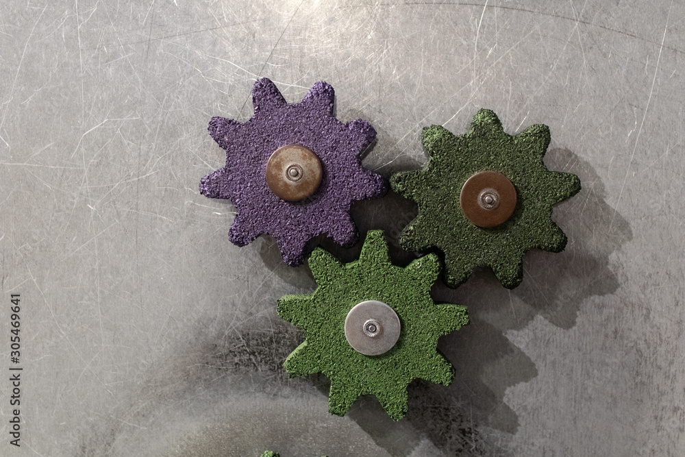 Bad gear wheels on a metal surface. gears for experiments for children ...
