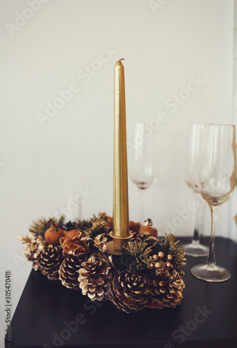 Christmas decoration with candles on wall background