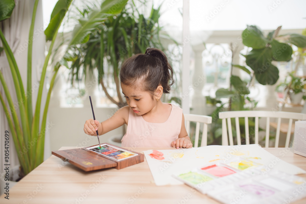 Going to school is your future. Education, learning, teaching. a young girl coloring a picture Going to school is your future. Education, learning, teaching. a young girl coloring a picture