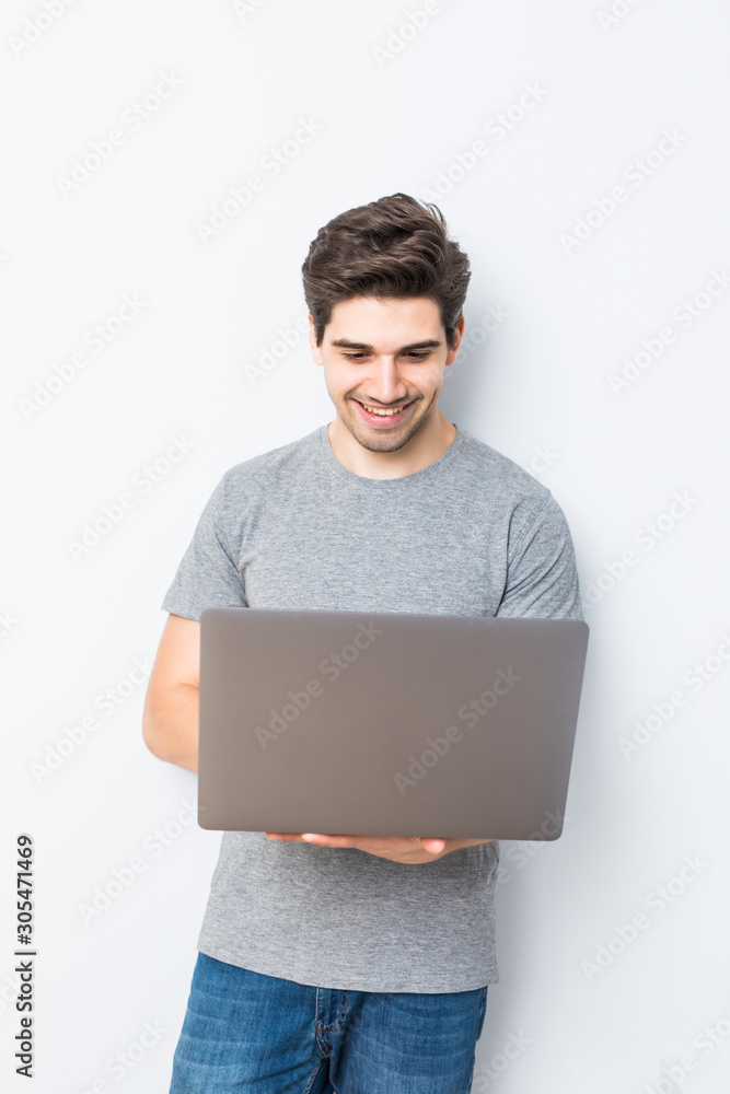 Portrait of young man with laptop isolated on white. Concept communication. Portrait of young man with laptop isolated on white. Concept communication.