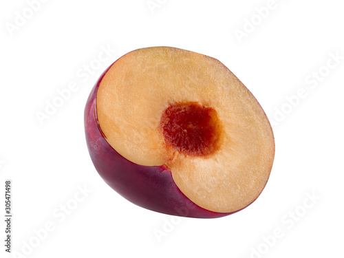 Half of smooth-skinned, purple plum fruit without kernel isolated on white background with copy space for text or images. Side view. Close-up. photo