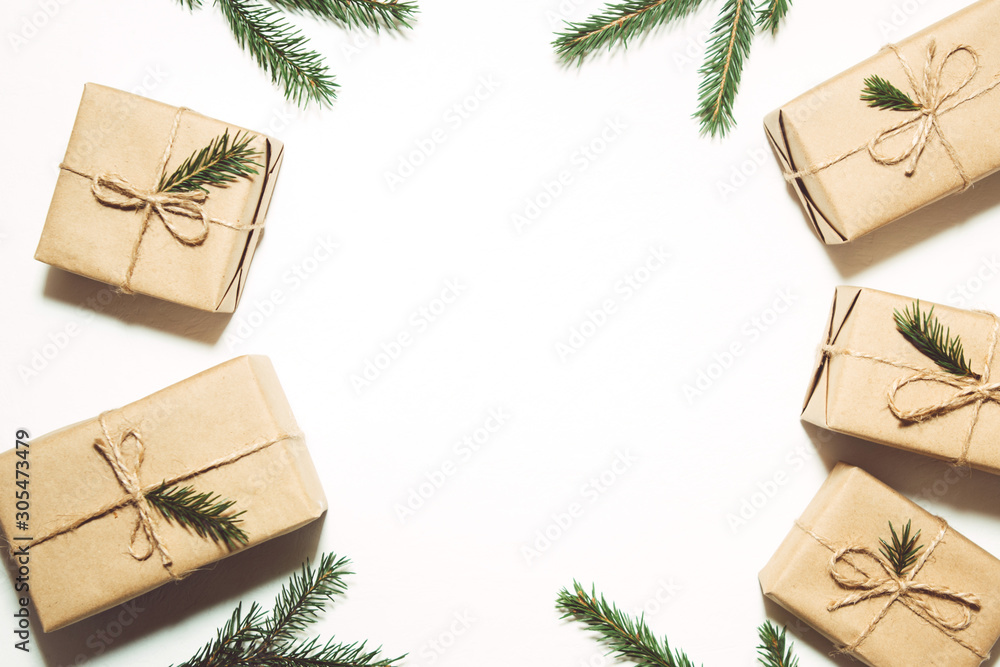 Craft gift boxes and fir branches, christmas background Craft gift boxes and fir branches, christmas background