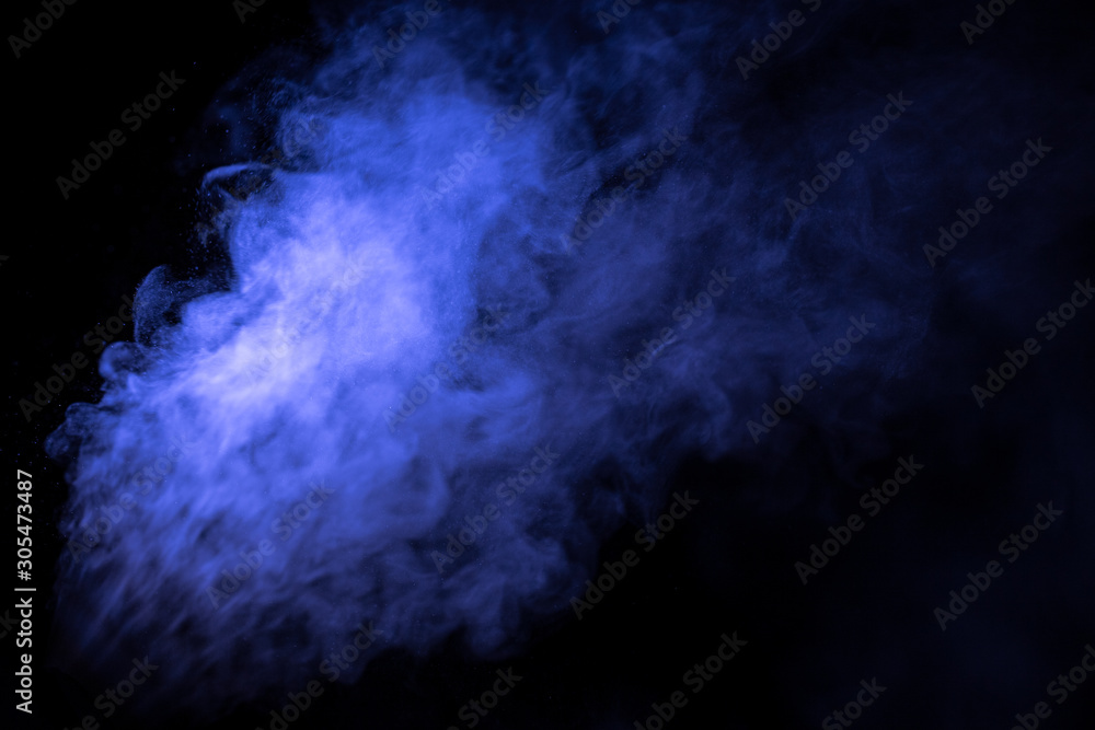 Jet of smoke on black background. Selective focus. Toned Jet of smoke on black background. Selective focus. Toned