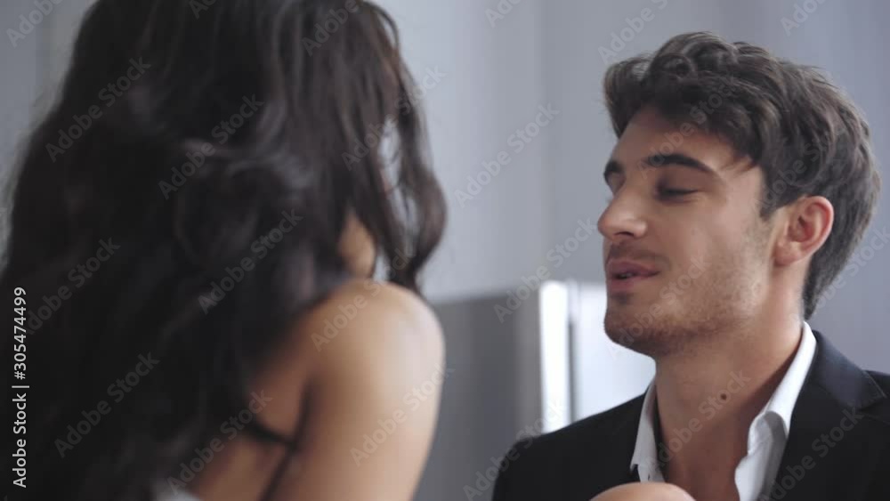 selective focus of businessman talking and hugging with girlfriend selective focus of businessman talking and hugging with girlfriend