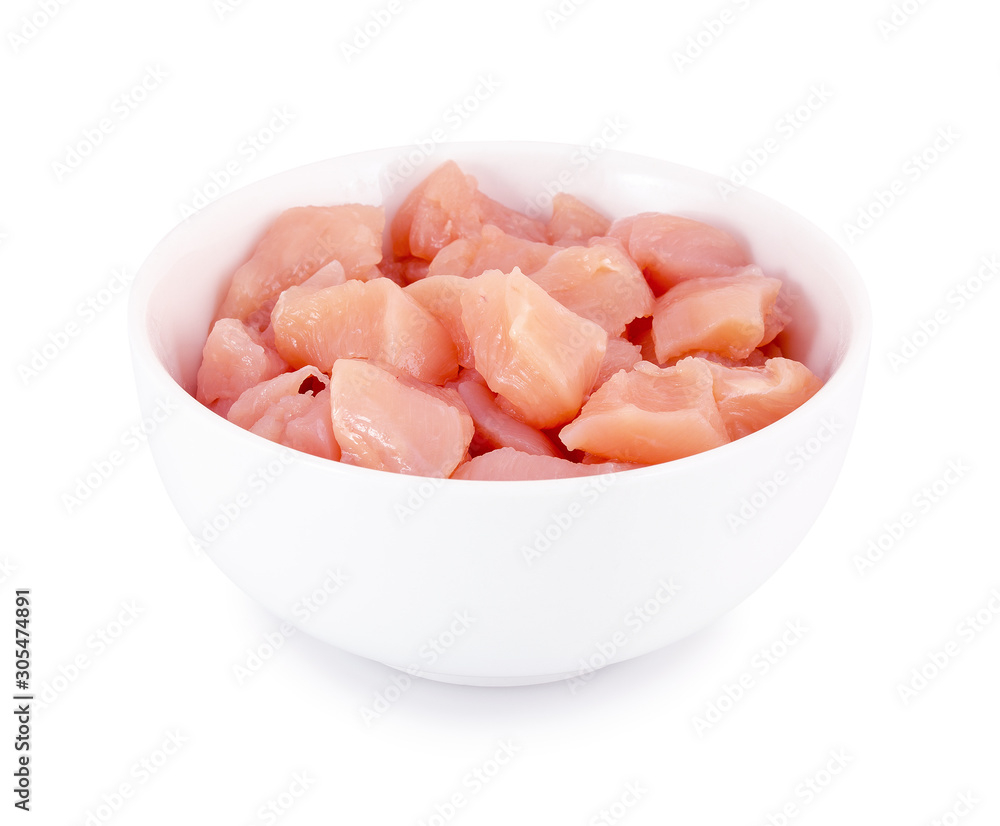 Raw chicken fillet in bowl isolated on white background with clipping path. Small pieces of raw meat on white backdrop. Raw chicken fillet in bowl isolated on white background with clipping path. Small pieces of raw meat on white backdrop.