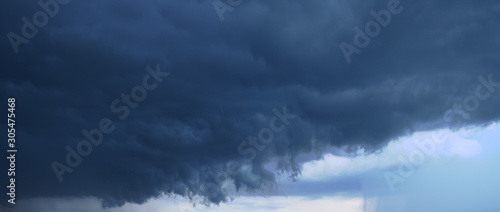 Panoramic photo of the sky. Late summer evening, dense cumulus clouds, pre-storm condition. 