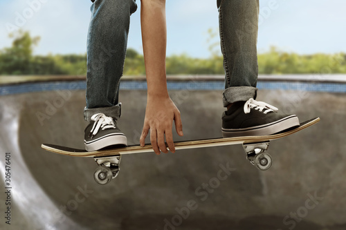 Skateboarder skateboarding at skate park