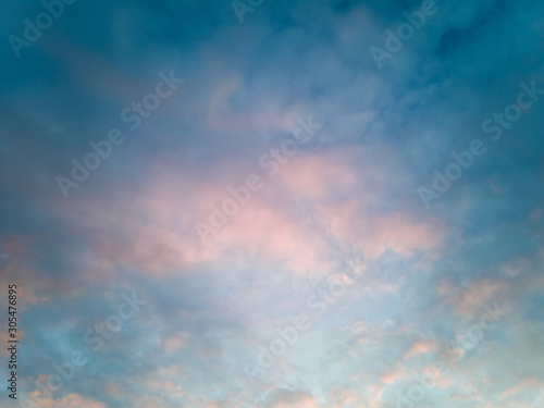 Beautiful evening sky at dusk with blue sky and pink clouds 