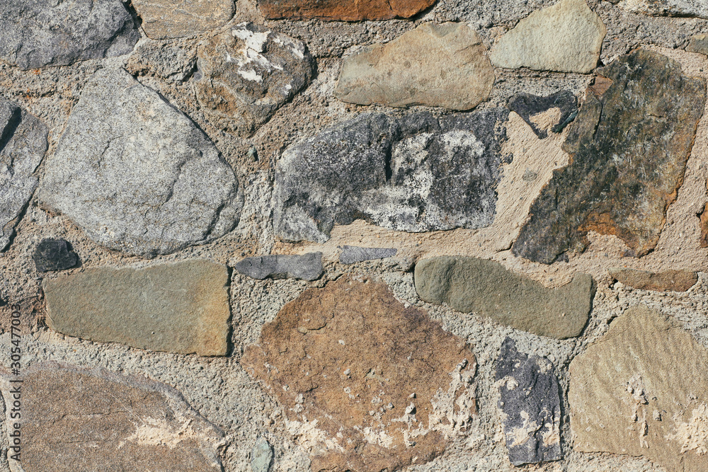 Fototapeta premium Concrete wall texture background. Natural stones. Building's facade decor. Decorative plaster. House exterior. Wall template for 3d design.