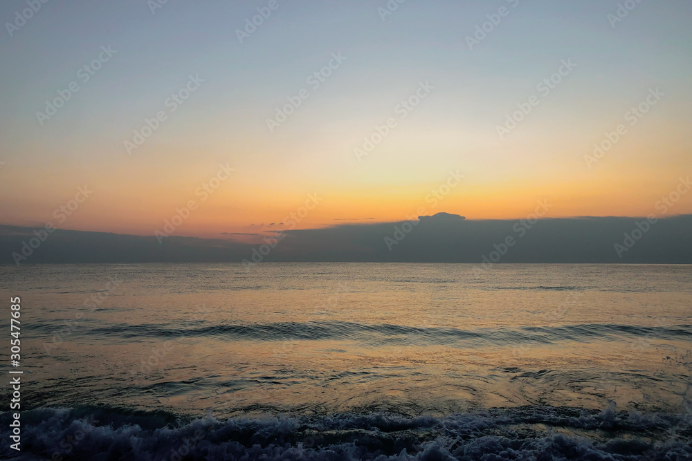 Beautiful sunrise on the sea beach. Thick sky. Natural relaxation. Beautiful sunrise on the sea beach. Thick sky. Natural relaxation.