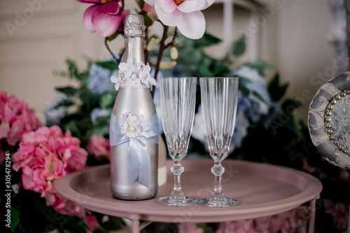 wedding glasses and wedding decor with flowers