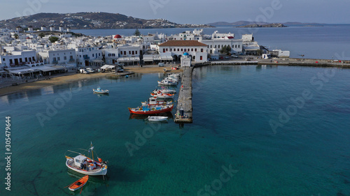 Aerial drone panoramic photo of picturesque old port in main village of Mykonos island at sunrise with beautiful colours, Cyclades, Greece © aerial-drone