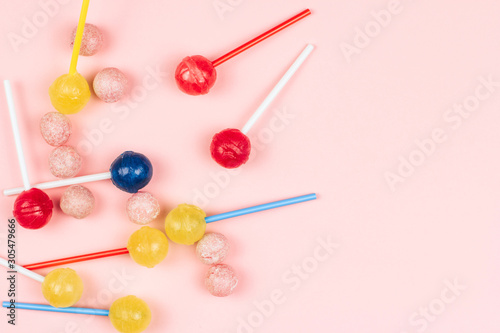 colorful lollipops on a pink background