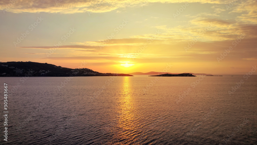 Obraz premium Aerial drone photo of beautiful sunset as seen from main village of Mykonos island, Cyclades, Greece