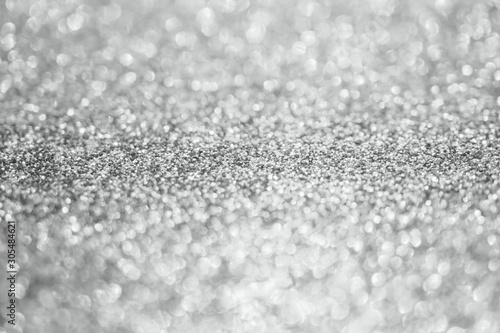 Abstract blur silver glitter sparkle defocused bokeh light background