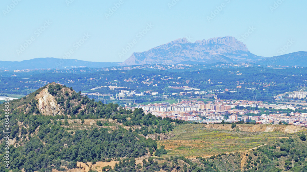 Mountain landscape in Catalonia overlooking the mountains and the small town of Sabadell