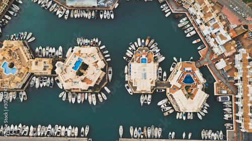 Aerial view of boats parked along circular houses in a beautiful harbour  Puerto Marina, Benalmadena, Spain photo