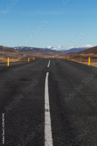 Road on a calm deserted spring landscape of Iceland