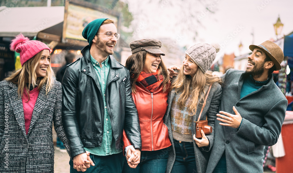 Millennial friends group walking at London city center Next