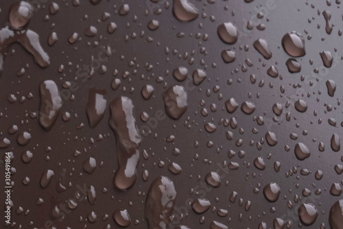 frozen water droplets on a metal surface