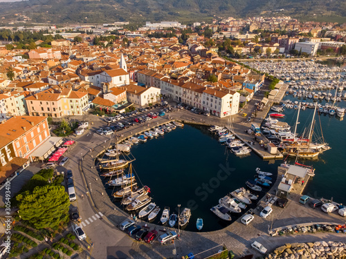 Slika na platnu Aerial view of boat at small marina in Izola, Slovenia.