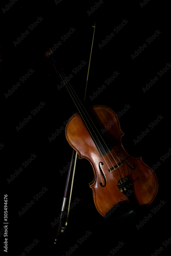 Fototapeta premium Instrument Violin on black background