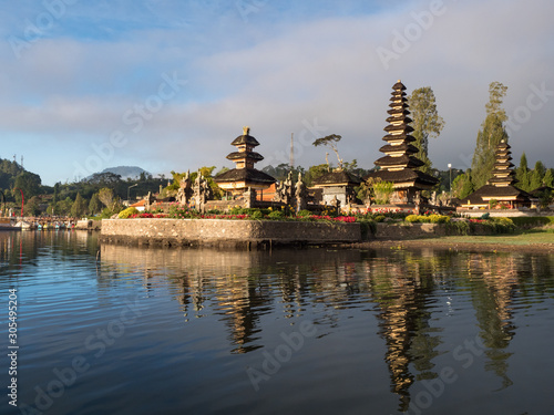 Indonesia, november 2019: Sunrise in Pura Ulun Danu Bratan, or Pura Beratan Temple, Bali island, Indonesia. Pura Ulun Danu Bratan is a major Shivaite and water temple on Bali island