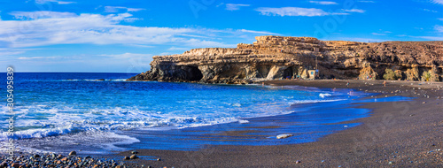 Black sandy beaches of volcanic Fuerteventura island, Ajui village. Canary islands