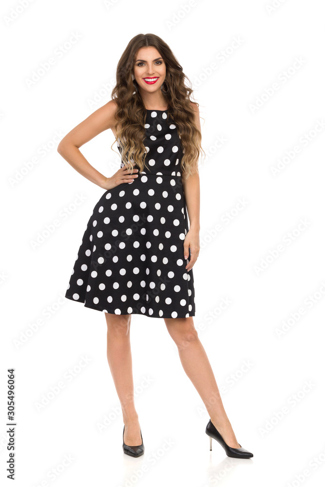 Beautiful Fashion Model In Black Cocktail Dress In Polka Dots And High Heels. Beautiful Fashion Model In Black Cocktail Dress In Polka Dots And High Heels.