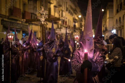 Crowd in costumes in Semana Santa Festival captured in Seville, Spain