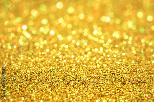 Luxury gold glitter with bokeh background, de-focused. concept for chrismas, holiday, happy new year, decoration.