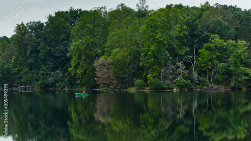 A quiet morning on the lake in early autumn fishing