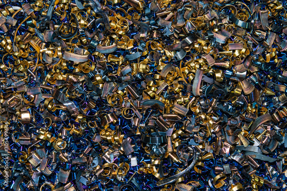 Metal shavings close-up multicolored. the waste after processing of metal drill to the lathe. Metal shavings close-up multicolored. the waste after processing of metal drill to the lathe.