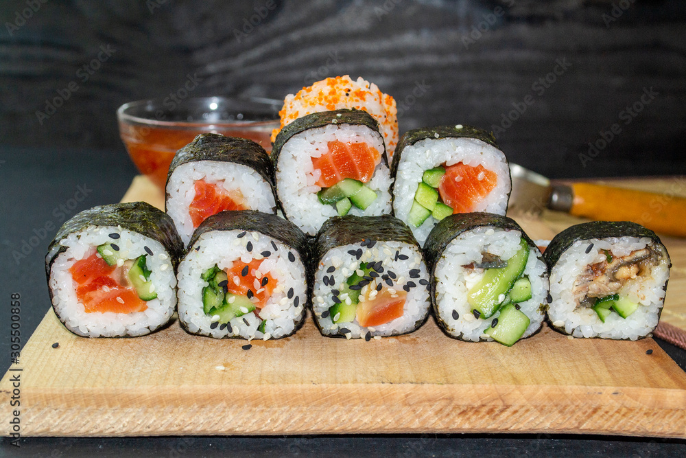 red fish sushi on a wooden tray red fish sushi on a wooden tray