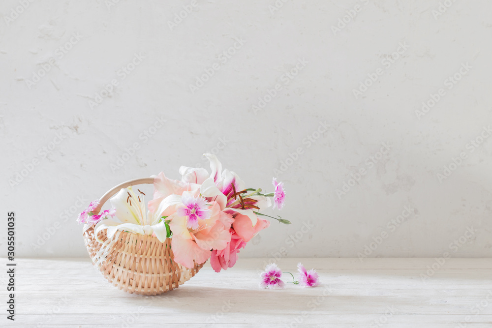 summer flowers in basket on white background summer flowers in basket on white background