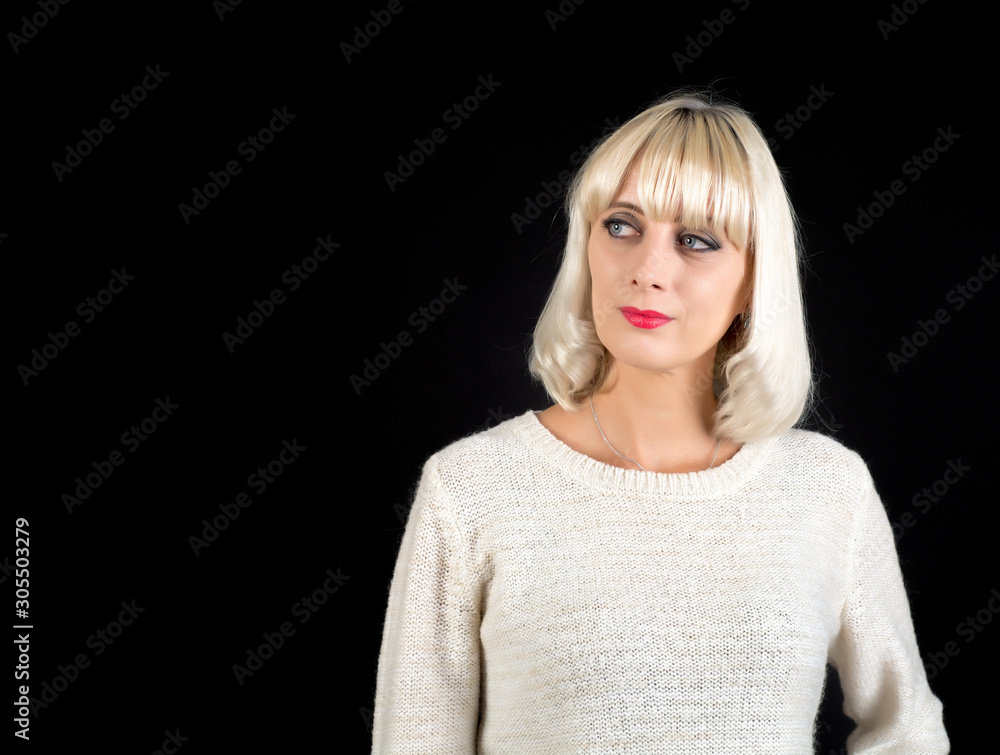 Shooting in the Studio. A beautiful woman with white hair stands on a dark background. Shooting in the Studio. A beautiful woman with white hair stands on a dark background.